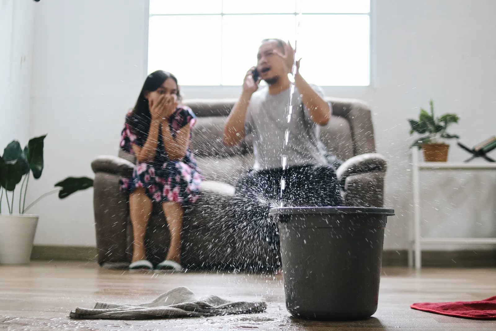 Family Calling Emergency Ceiling Leak