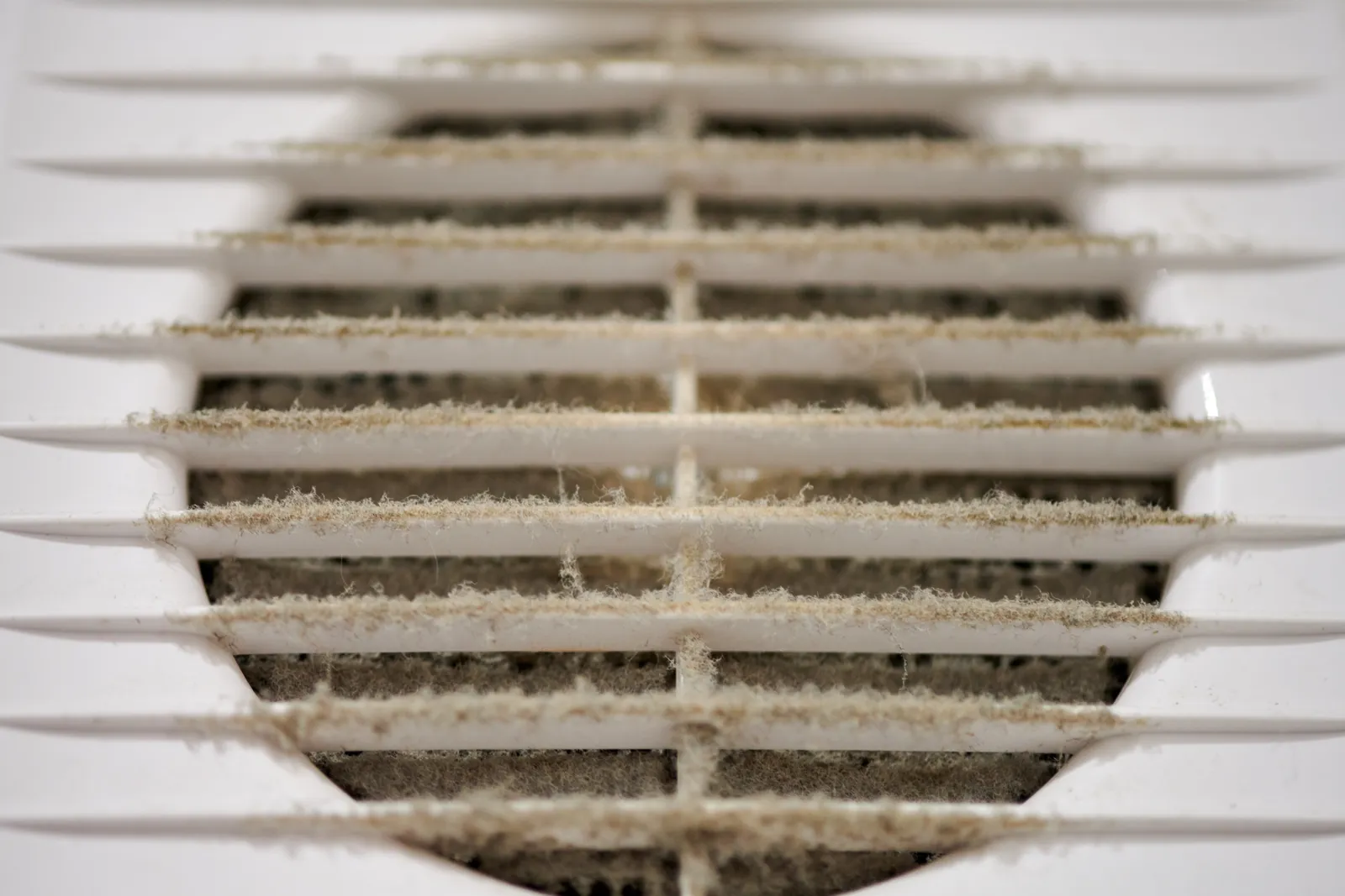 Dirty HVAC vent grille with clogged filter